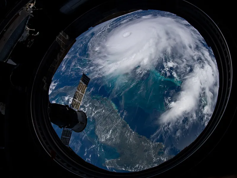 A large hurricane with a clear eye over the ocean, seen from orbit