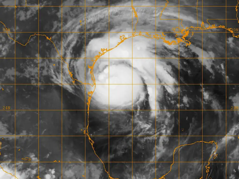 A false-colour infrared satellite picture of a hurricane, with the coldest, highest cloud tops in bright colours